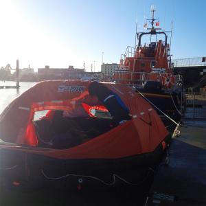 Lifeboat volunteers recover liferaft