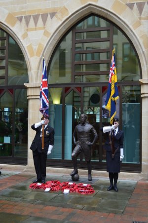 A guard of honour and wreaths at the memorial ceremony at Walter Tull's statue at Northampton Guildhall