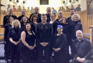 Soundwaves Choir members with musical director Peter Futcher